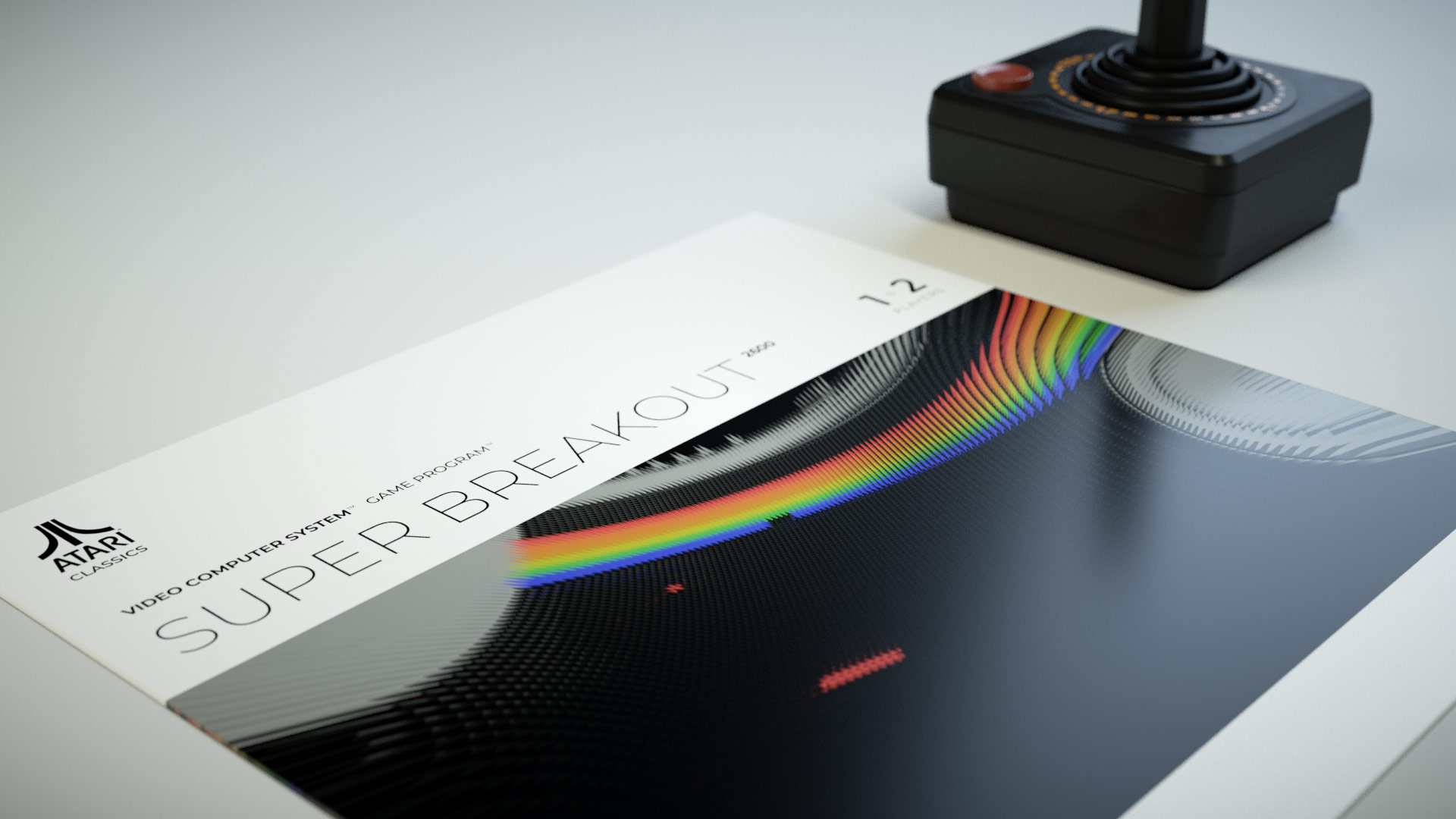 A studio layout showing the reimagined Super Breakout sleeve resting flat on a white surface next to a highly accurate 3D model of the black Atari CX40 joystick controller.