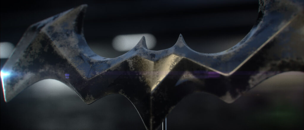 Batarang Motion Sequence – Opening Frame The opening frame from a cinematic motion sequence of the custom 3D Batarang model, showing the weathered metallic prop angled slightly as it enters a shallow depth of field.