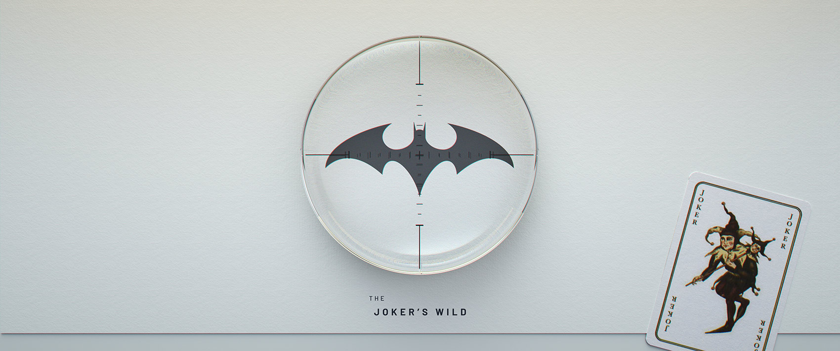 The main title card layout for the project, featuring a centred circular glass lens with a bat logo and crosshair reticle, the title text 'THE JOKER'S WILD' positioned below, and an illustrated Joker playing card in the bottom right corner.