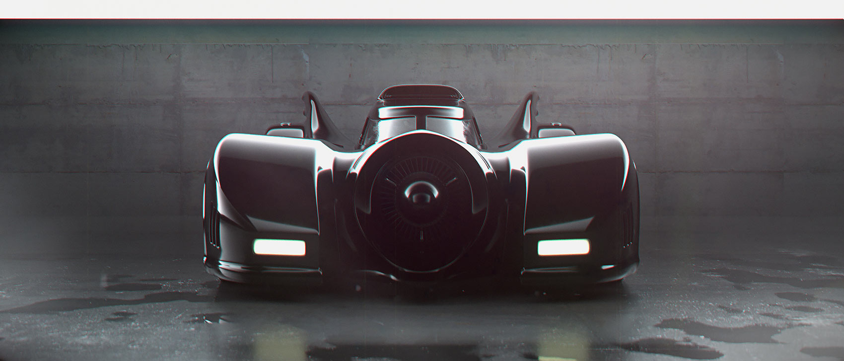 A dead-on frontal studio composition of the Batmobile against a minimalist brutalist concrete wall, showing symmetrical specular highlights curving over the black fenders and reflecting on a wet floor.