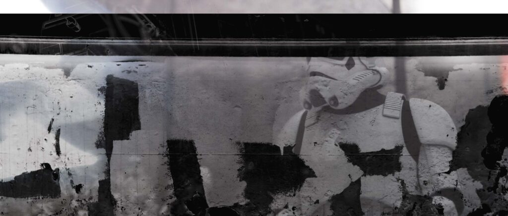 A high-contrast graphic design frame featuring a Stormtrooper asset heavily masked by distressed black paint textures, ink bleeds, and simulated torn paper borders.