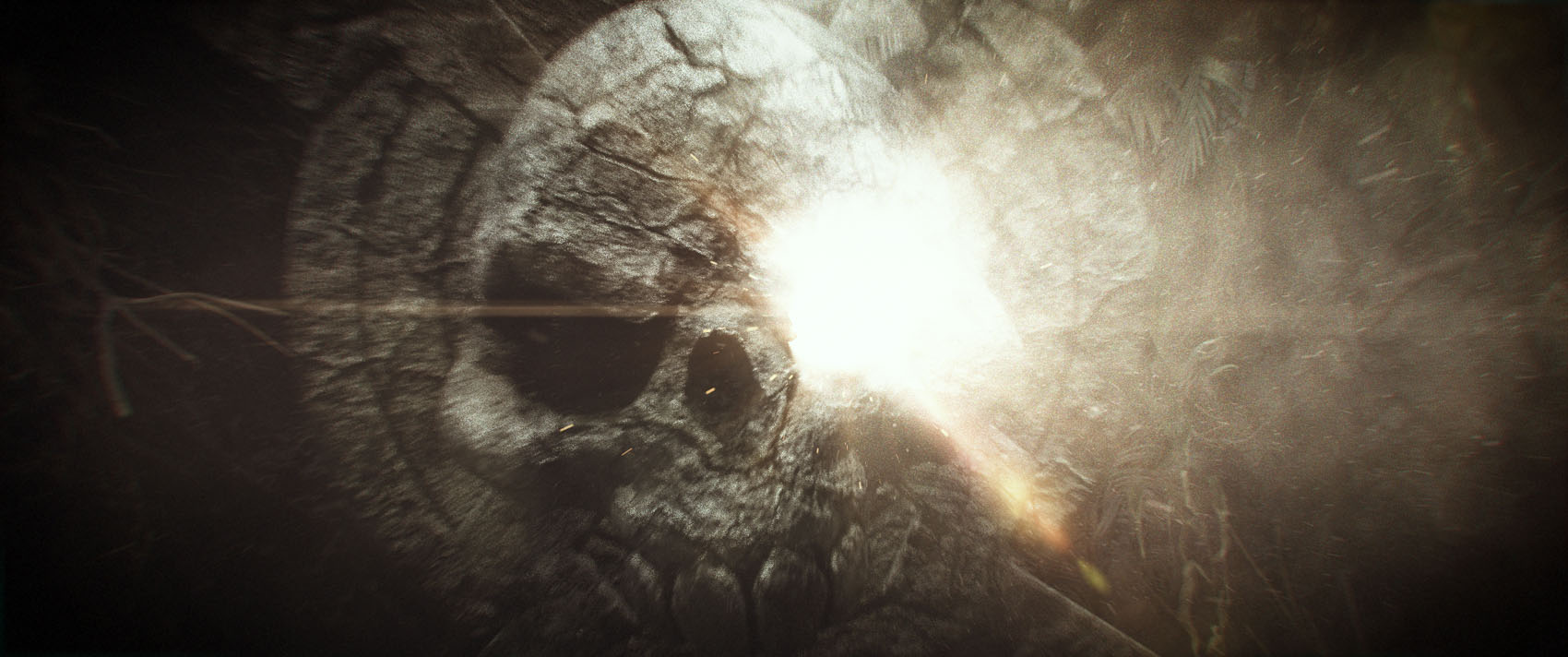 An extreme close-up film concept frame where a blindingly bright volumetric light flare and thick atmospheric smoke erupt across the weathered surface of the stone skull.