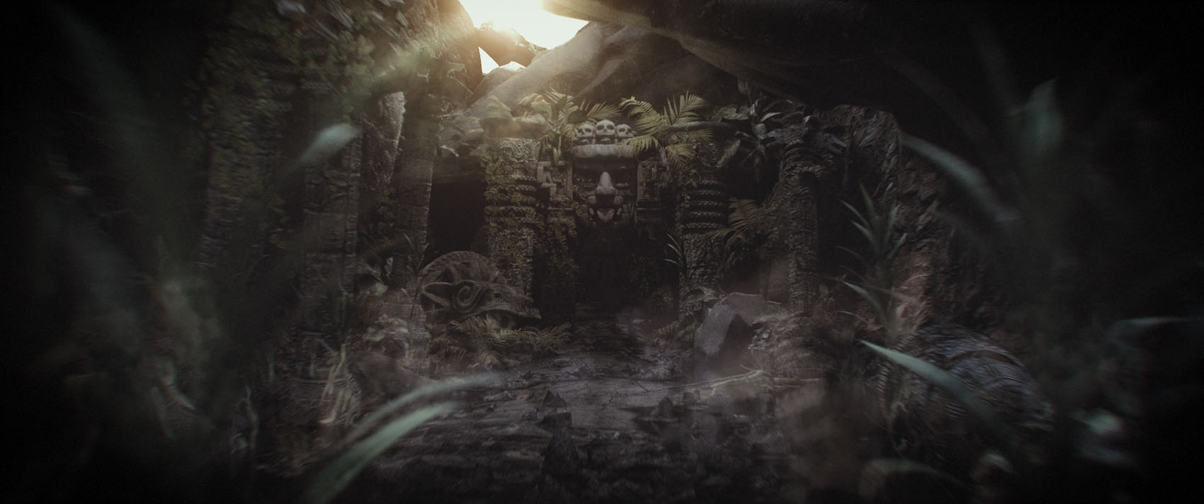 A wide, atmospheric film frame capturing an ancient jungle temple hidden in deep shadows, heavily framed by dark foreground foliage with bright overhead sunlight cutting through the canopy.