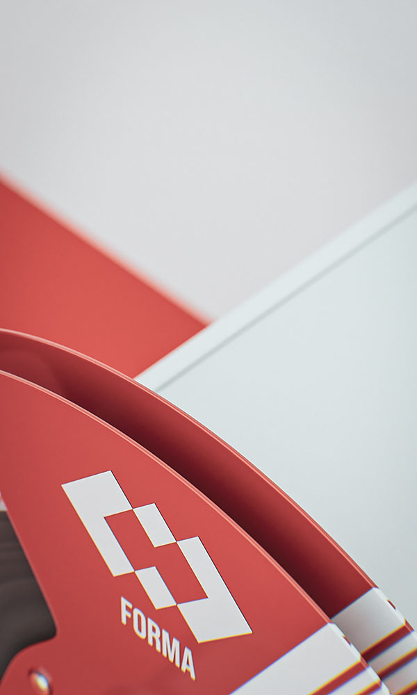Abstract studio composition focusing on the sweeping curved edge of a red anodized aluminum tape reel featuring the white branding emblem.
